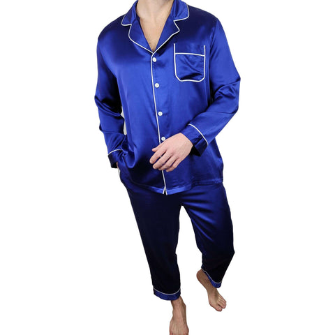 mens midnight blue silk pajamas worn by a model on a white screen background